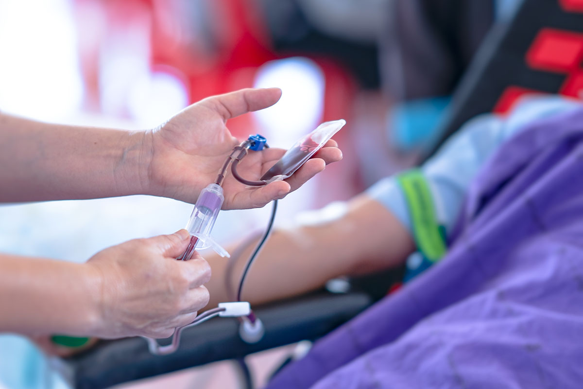 Blood donation collection, hand of donor and needle for give blood to bag