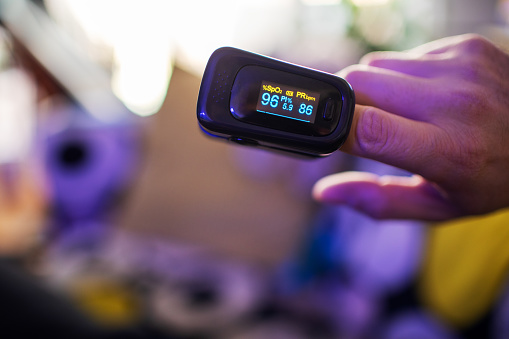 Oximeter for checking oxygen saturation in blood on male hand