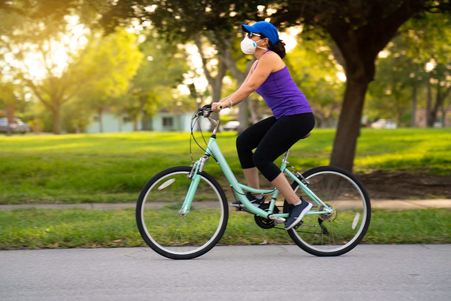 Woman cycling on the neighborhood