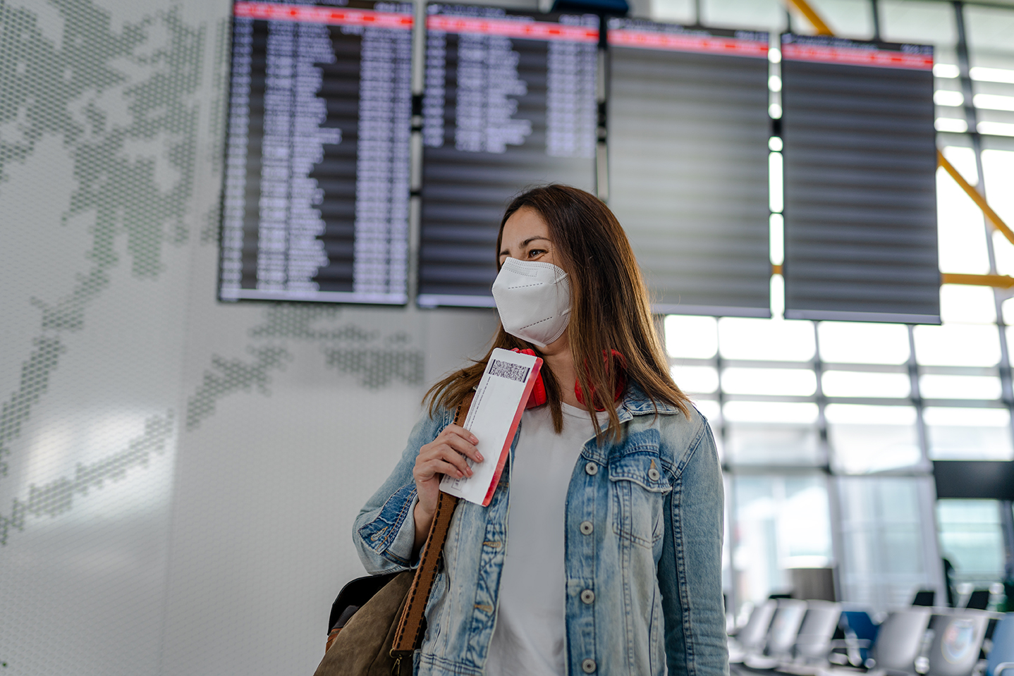 Young woman ready for her first flight after covid-19 vaccination