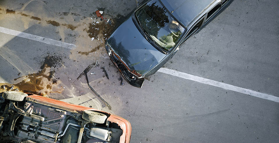 Elevated view of broken cars after accident.