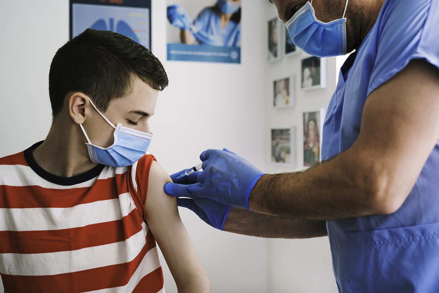 Patient Getting Vaccinated against COVID-19. Child, teenage boy vaccination. Coronavirus epidemic. Copy space.