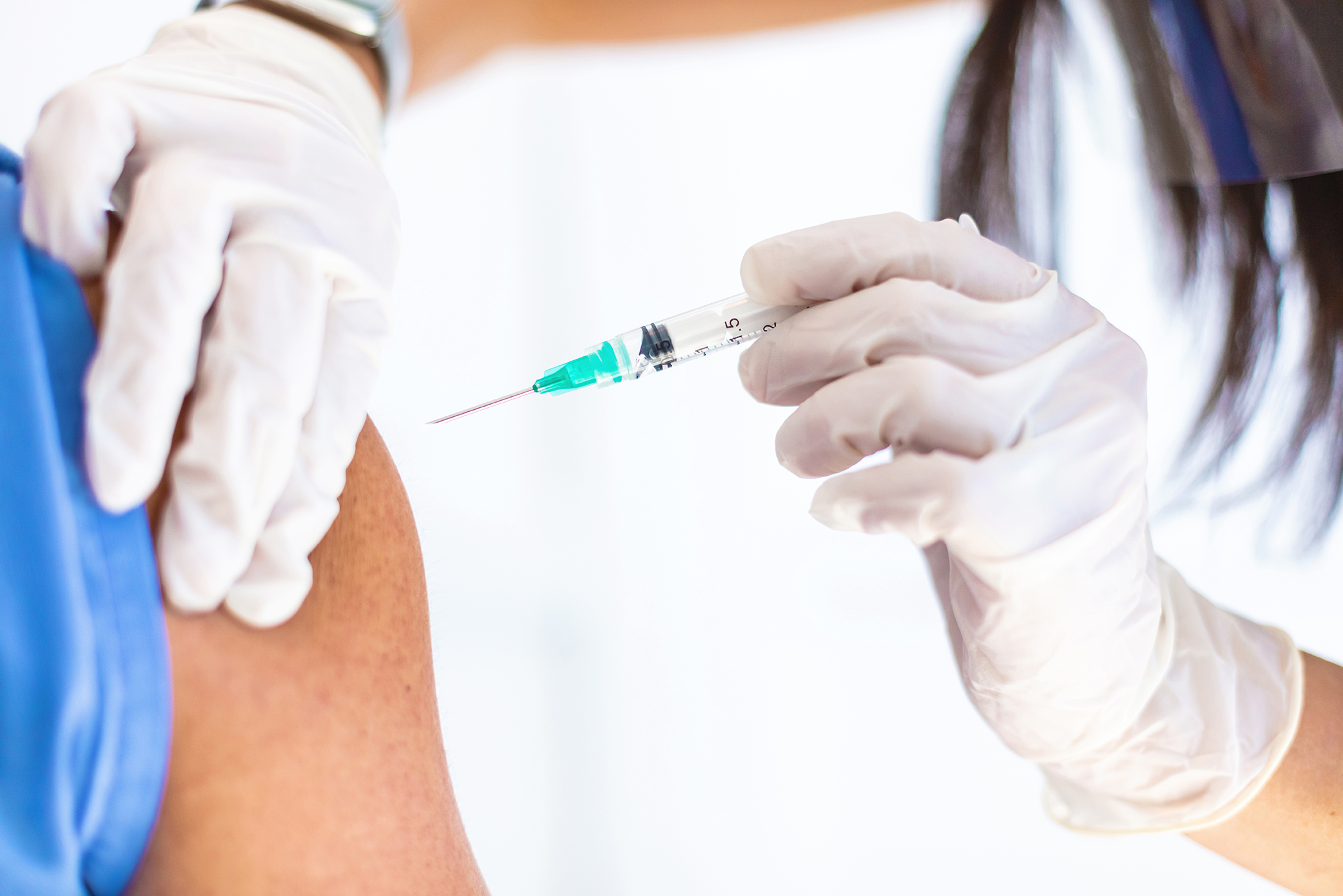 In Western Colorado  Covid-19 Cororona Virus Vaccine Flu Shot Being Given by Medical Professional to Patient Photo Series Matching 4K Video Available (Shot with Canon 5DS 50.6mp photos professionally retouched - Lightroom / Photoshop - original size 5792 x 8688 downsampled as needed for clarity and select focus used for dramatic effect)