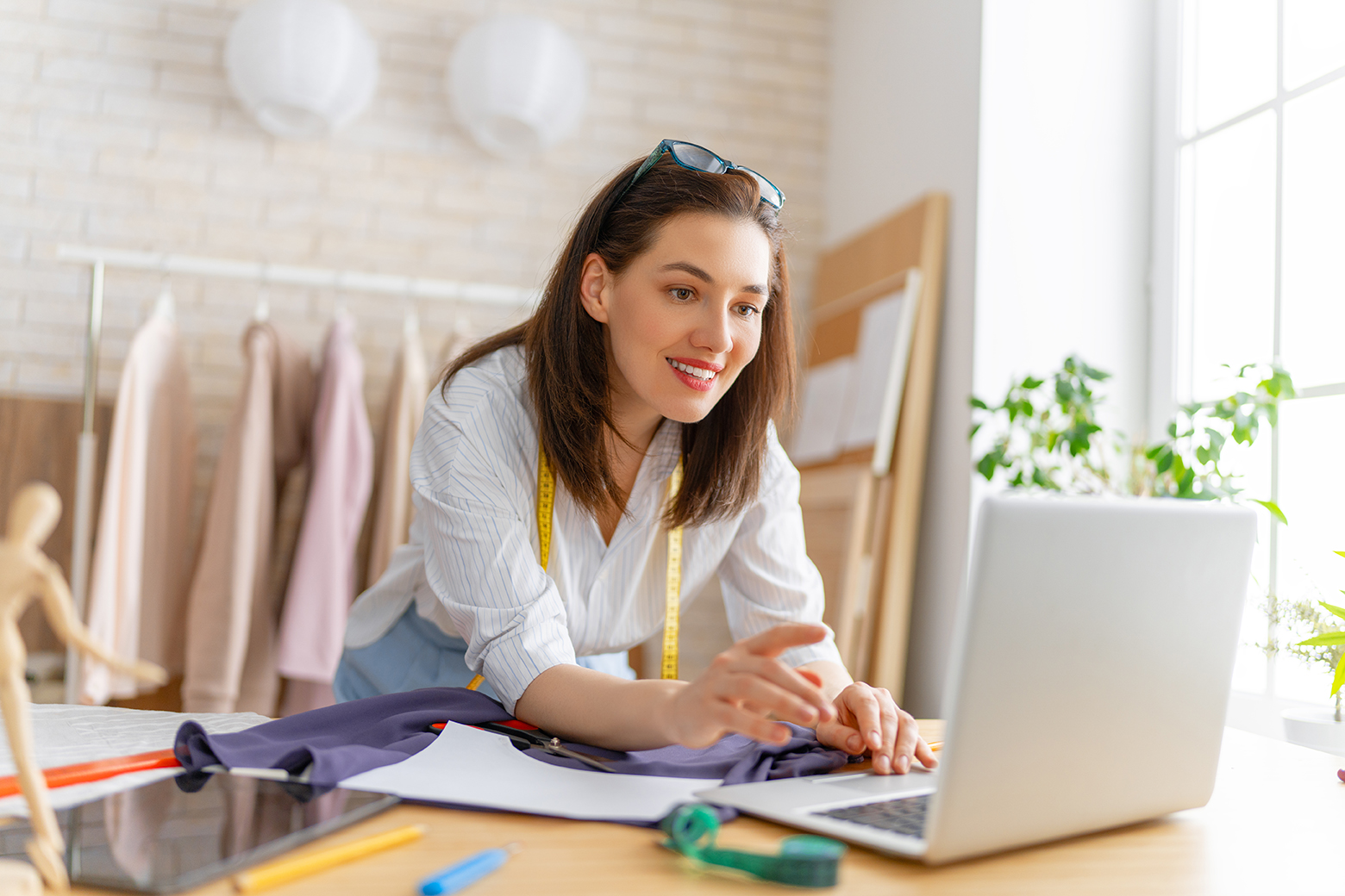 Woman is working at workshop. Concept of small business.