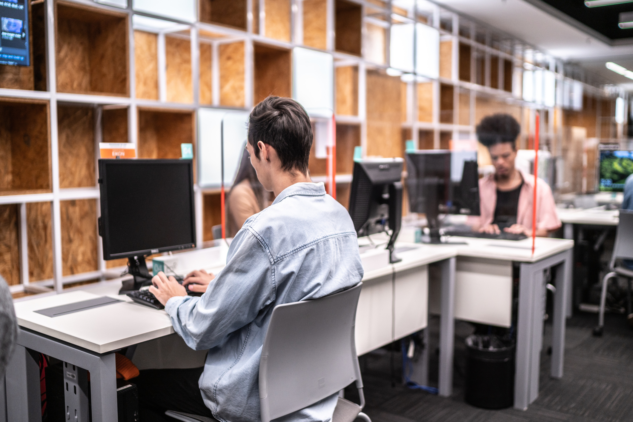 University student working on computer in the library at campus